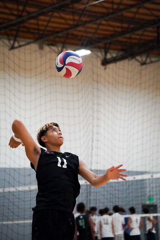 Josh tossing the ball to serve