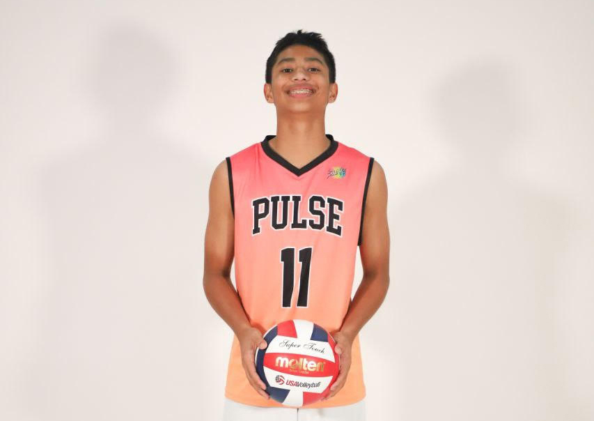 Josh Rathnam in his Pulse #11 jersey holding a volleyball